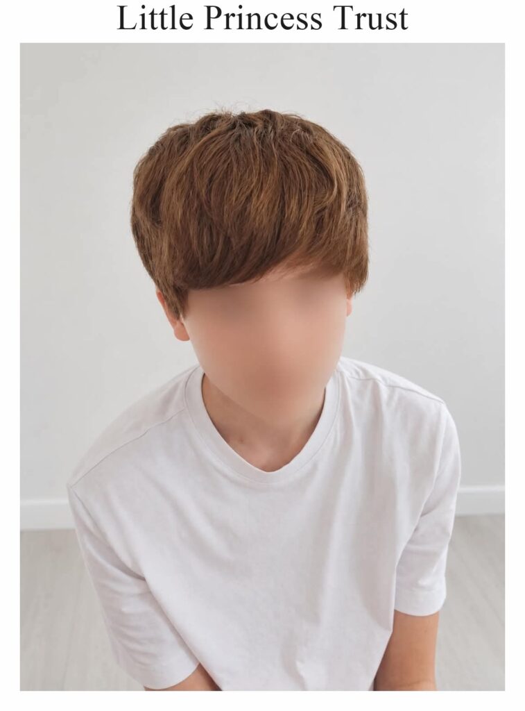 Little Princess Trust wig: a short brown cut, worn by a child