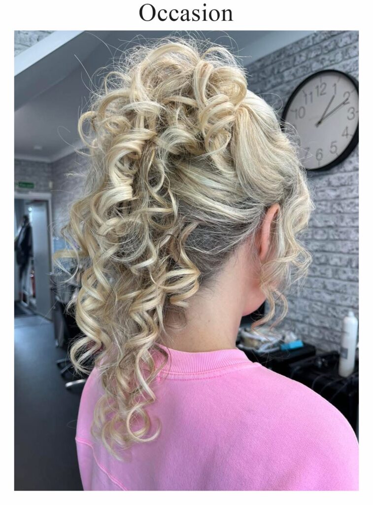 Occasion hair: blonde curls pinned up at the back