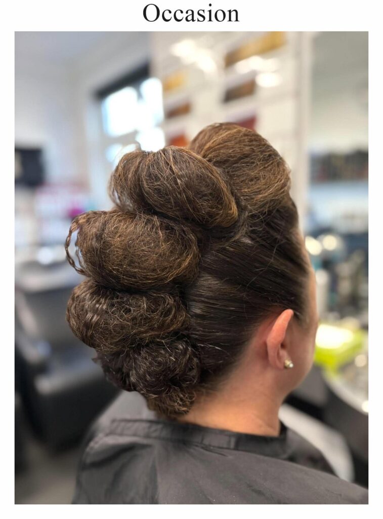 Occasion hair: a sculpted dark updo with volume at the crown