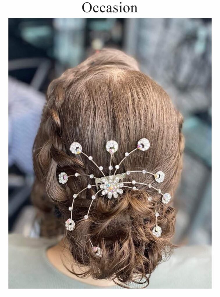 Occasion hair: a low updo with a pearl hair vine