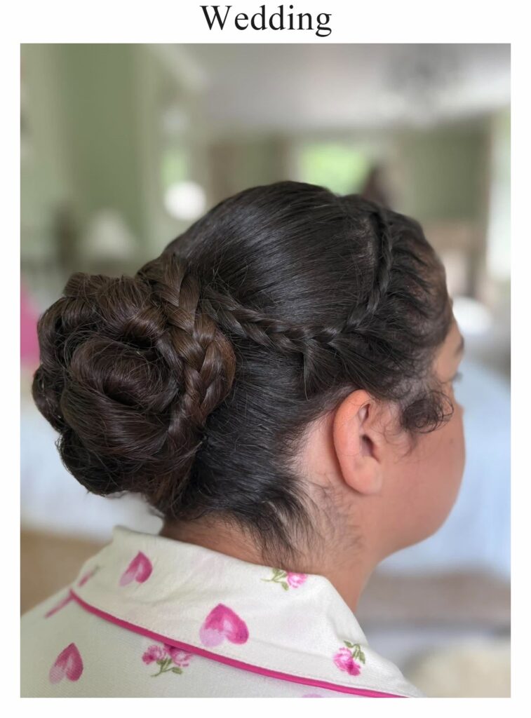Wedding hair: a dark chignon with a plait