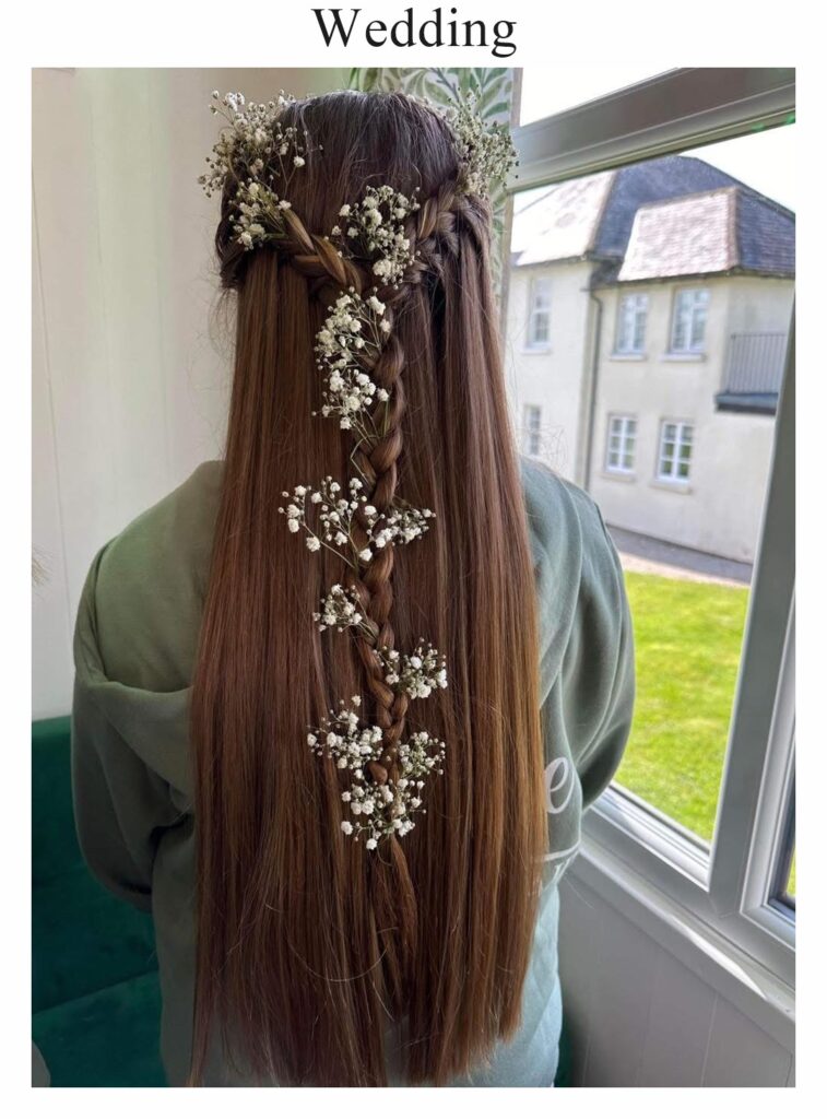 Wedding hair: long, straight brown hair with a flower and pearl hair vine