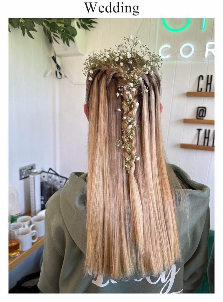 Wedding hair: long, straight blonde hair with gypsophila at the crown