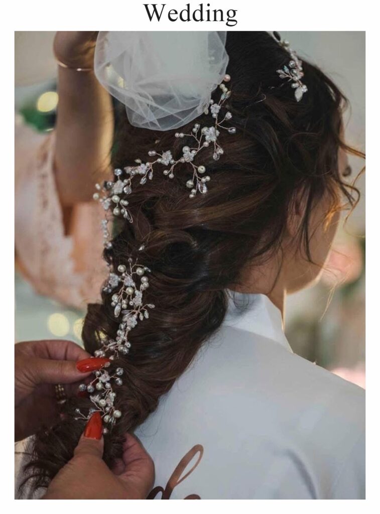 Wedding hair: a long, loose plait with a pearl hair vine and veil