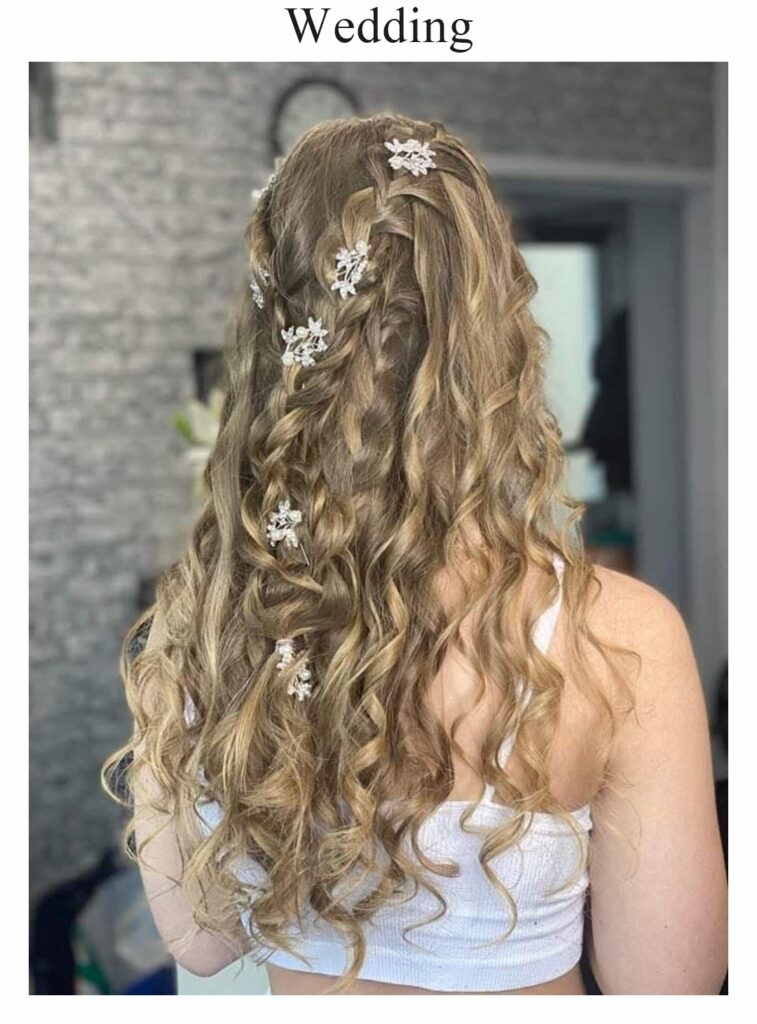 Wedding hair: long blonde curls with small flowers